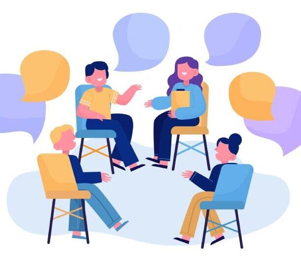 A group of mental health professionals engaged in face-to-face discussion during Group Supervision in Counseling session.