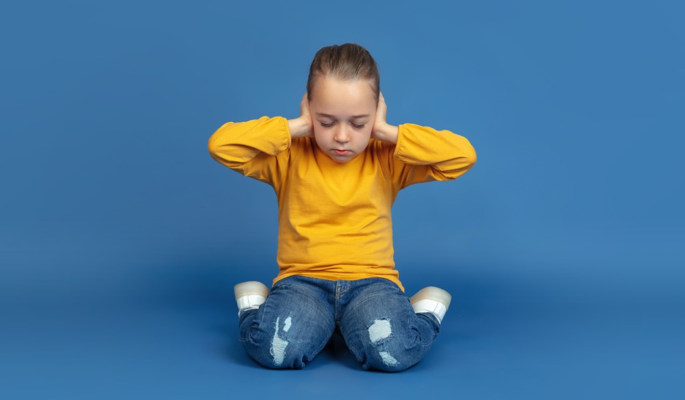 A small child exhibiting symptoms of Autism Spectrum Disorder